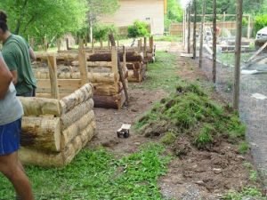 Pile of soil and grass from digs elsewhere to begin filling of raised beds.jpg
